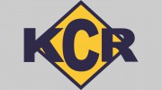 K C R